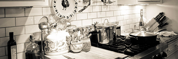 A black and white photo of the Just Simply... Cuisine Kitchen